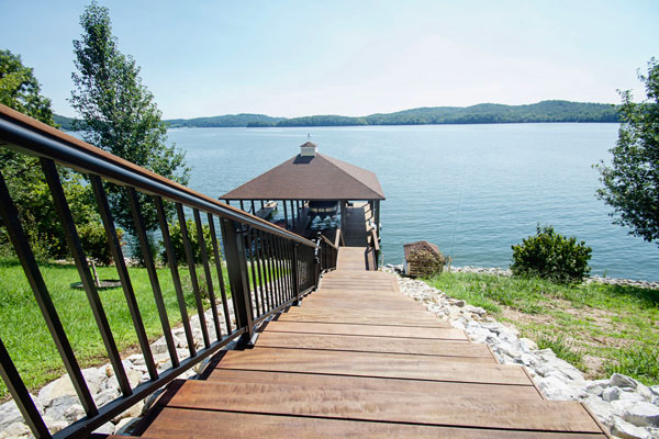 Image of a long set of steps that is attached to a dock with an area for entertaining.